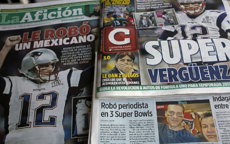 Mexican newspapers show headlines and photos Tuesday about the media executive suspected of stealing Tom Brady’s Super Bowl jersey (bottom left in photo with Brady). The headlines read in Spanish, “Super embarrassment” (top right) and “Was stolen by a Mexican” (left).