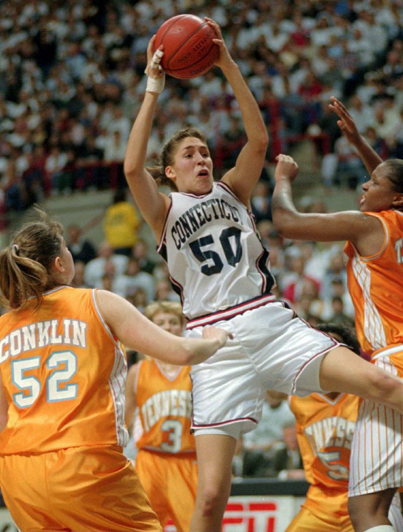 Connecticut forward Rebecca Lobo (center) pulls down a rebound against Tennessee during a game on Jan. 16, 1995. No Huskies’ player on this year’s roster was born the last time the program had a losing streak, which occurred during Lobo’s sophomore season.