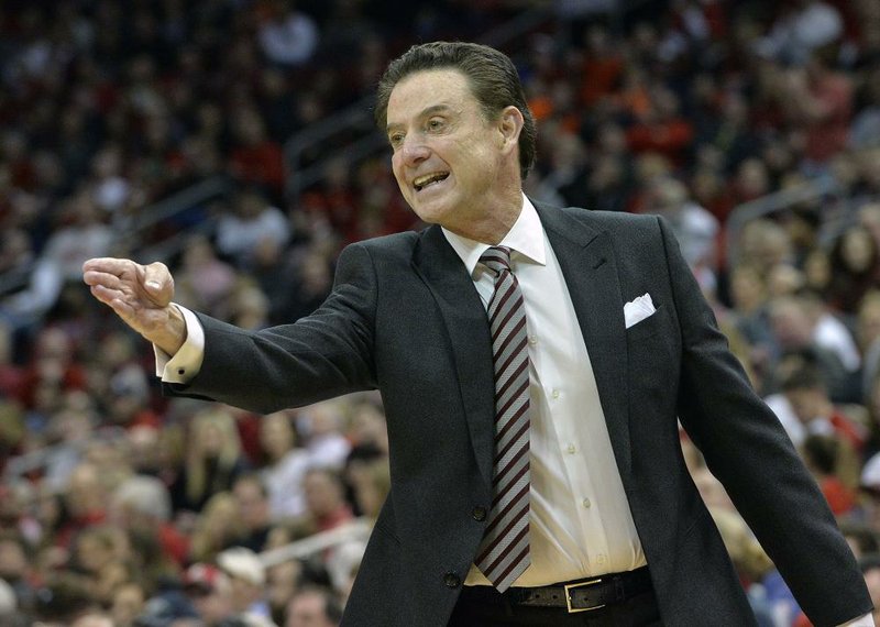 Louisville's head coach Rick Pitino shouts instructions to his team during the first half of an NCAA college basketball game against Syracuse, Sunday, Feb. 26, 2017, in Louisville, Ky. 