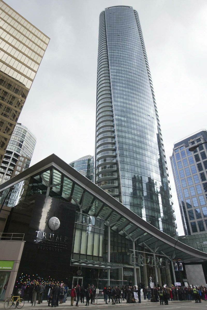 Protesters gather outside the Trump International Hotel and Tower in Vancouver, British Columbia, last month. Amid a politically charged time, the Trump Organization is planning a new chain of hotels. 