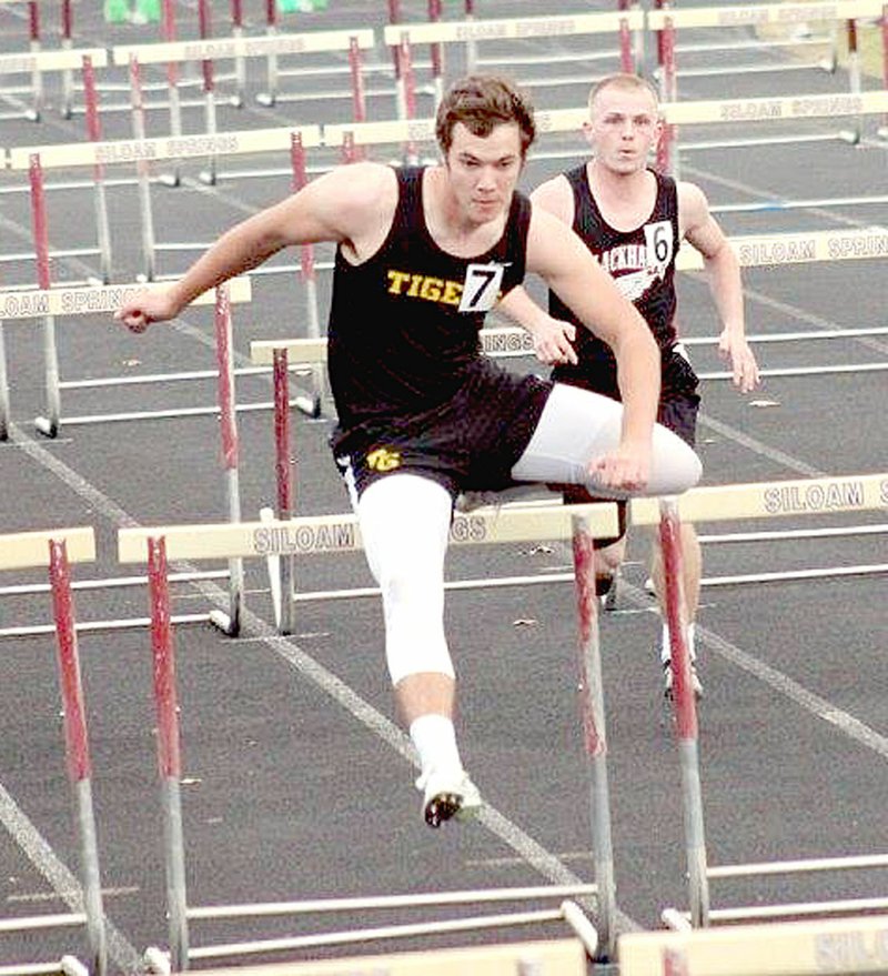 Photo courtesy of Tracy Walker Prairie Grove senior Sol Walker clears a hurdle during the Panther Relays at Siloam Springs. Walker placed in the 110 meter hurdles last week at the Lion Invitational hosted by Gravette.