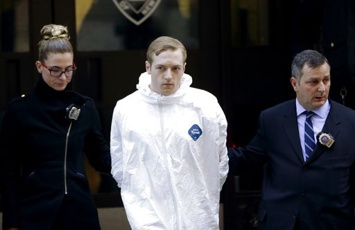 James Harris Jackson is escorted out of a police precinct in New York on Wednesday, March 22, 2017. 