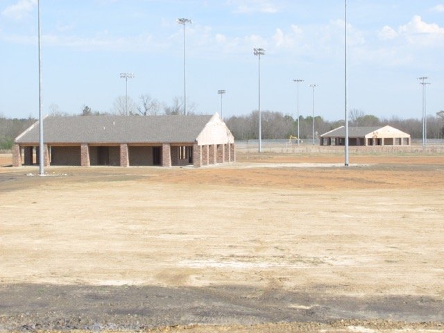 Concession buildings, lights and fencing stand out on the unfinished River Valley Sports Complex at Chaffee Crossing.