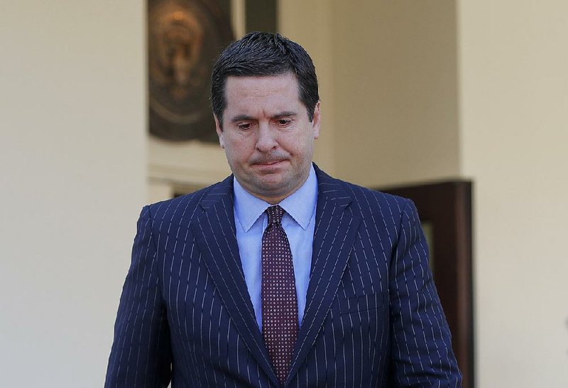 Rep. Devin Nunes, chairman of the House Intelligence Committee, leaves the White House after briefing President Donald Trump on surveillance intelligence Wednesday. 