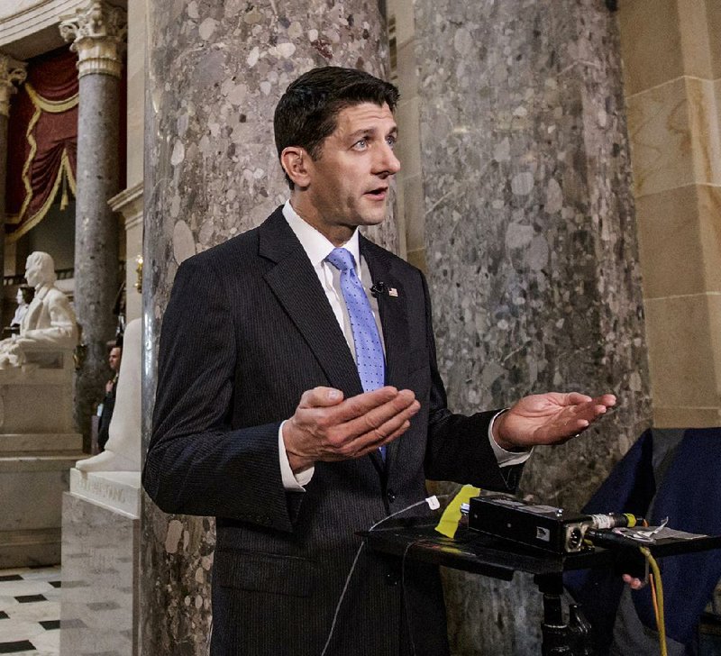 House Speaker Paul Ryan discusses the GOP health care plan Wednesday on Capitol Hill. In a radio interview that day, Ryan called opposition to the plan part of “the tempest of the legislative process.” 
