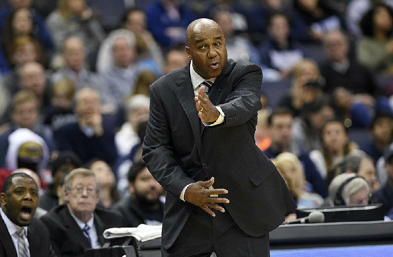 In this March 4, 2017 file photo, Georgetown head coach John Thompson III gestures during the second half of an NCAA college basketball game against Villanova, in Washington. Georgetown has fired Thompson after two consecutive losing seasons at the program his father led to a national championship.  