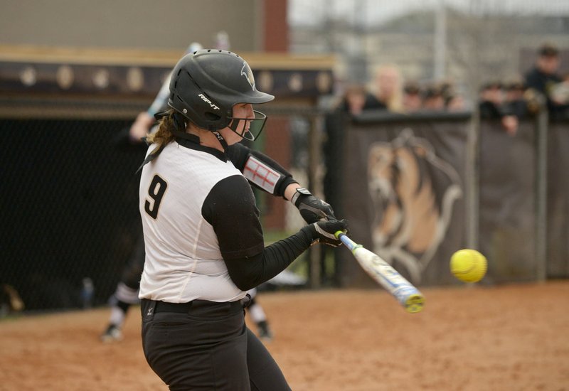 Haley Cornell, Bentonville catcher, hits a foul ball Thursday, March 16, 2017, during the softball game against Van Buren at Bentonville's Tiger Athletic Complex.