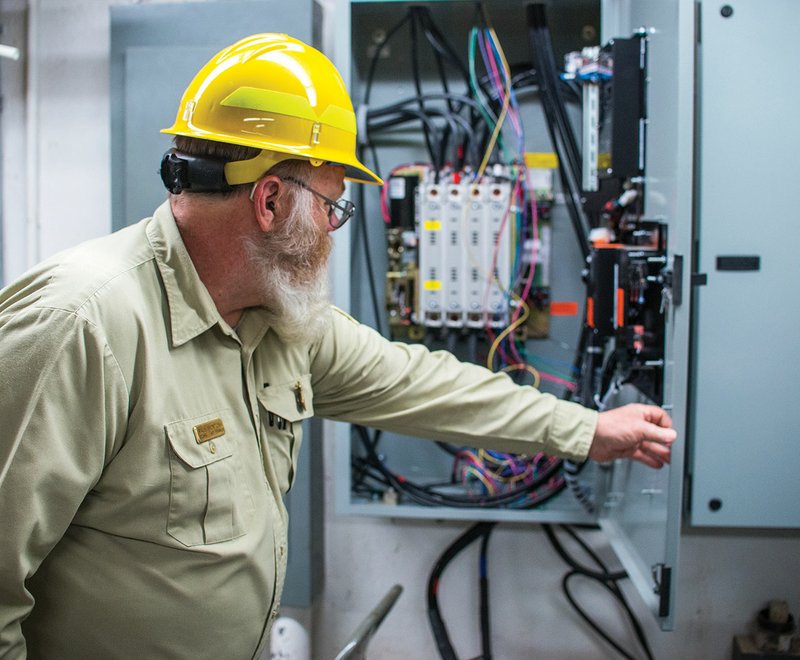 Paul McIntosh, supervisory guide/inspector in training to oversee the contractors during the work on Blanchard Springs Caverns, shows off the Phase 1 improvements of the electrical systems that will run the facility at the caverns.