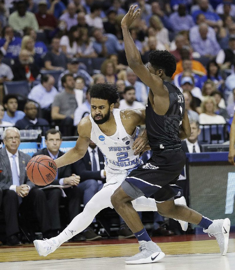 North Carolina’s Joel Berry (2) drives toward the basket during the Tar Heels’ victory in the South Regional semifinals Friday night. The Tar Heels will play the winner of Friday’s late game between Kentucky and UCLA on Sunday for a trip to the Final Four.