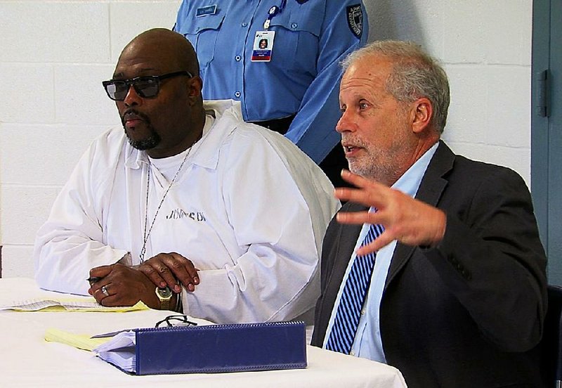 Death-row inmate Stacey Johnson (left) sits with his attorney, Jeff Rosenzweig, as Rosenzweig addresses the Parole Board in this 2017 file photo.