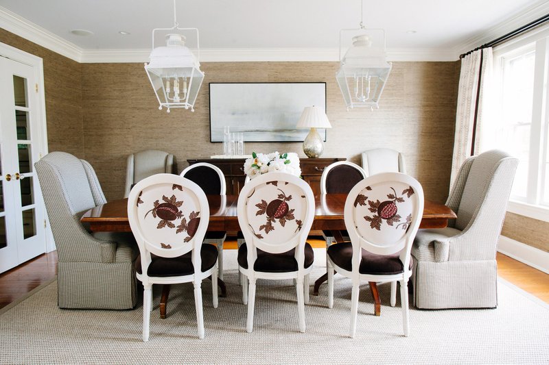 A dining room in Potomac, Md., designed by Erica Burns has Restoration Hardware side chairs upholstered in different fabrics.