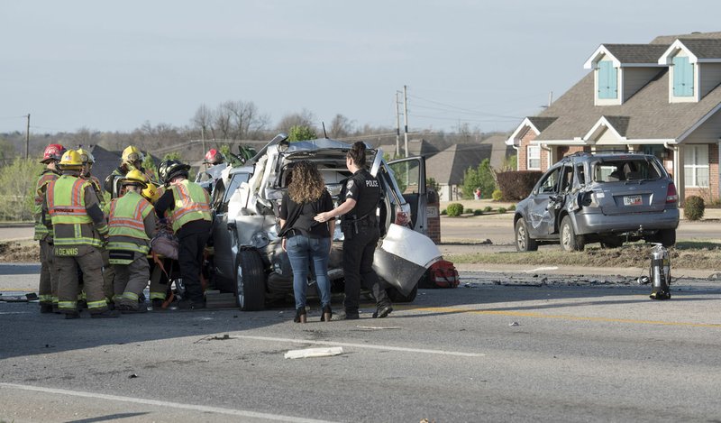 Springdale, Lowell and Bethel Heights fire department's work Friday to free a driver from a vehicle crash on North Thompson south of Wagon Wheel.