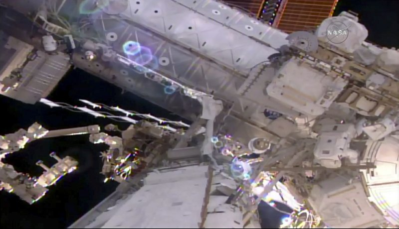 This still image taken from live video provided by NASA shows astronaut Shane Kimbrough, right, works on the International Space Station during a space walk on Friday, March 24, 2017. 
