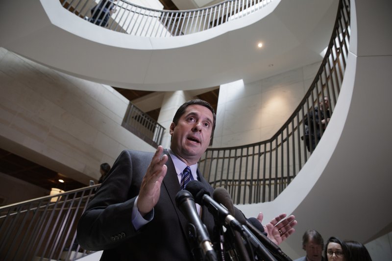 House Intelligence Committee Chairman Devin Nunes, R-Calif., left, speaks to reporters at the Capitol in Washington, Friday, March 24, 2017. Nunes said Friday that Paul Manafort, the former campaign chairman for President Donald Trump, volunteered to be interviewed by committee members. (AP Photo/J. Scott Applewhite)