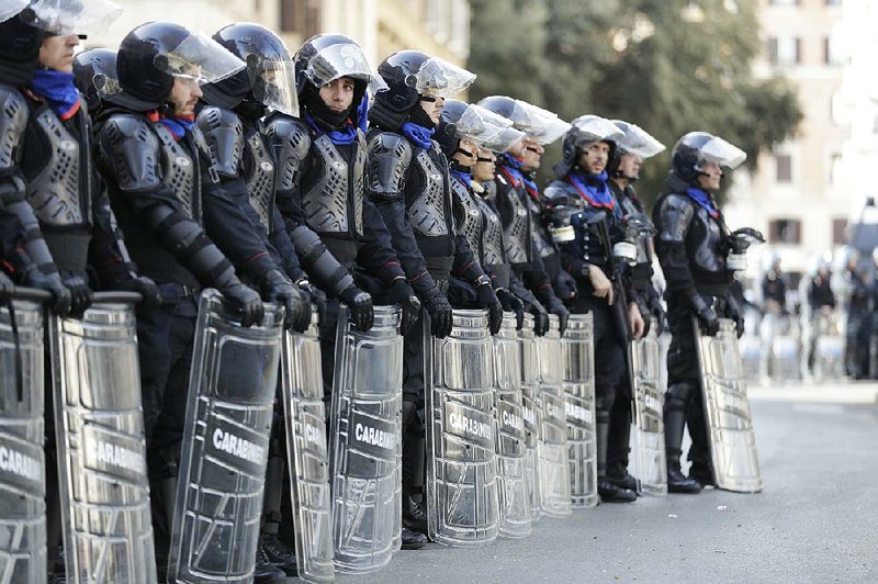 Police line up as protesters showing their support for the European Union march Saturday in Rome, where EU leaders gathered to mark the bloc’s 60th anniversary.