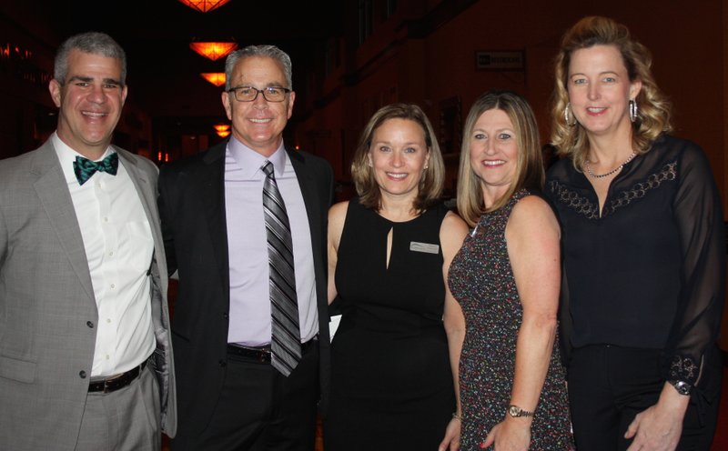 NWA Democrat-Gazette/CARIN SCHOPPMEYER Maury Peterson, Northwest Arkansas Children&#8217;s Shelter executive director (center), with board members Arist Mastorides, Chris Lamson, Lori Collins and Erika Zubriski, welcome guests to the 2017 Starlight Gala on &#0010;March 4 at the John Q. Hammons Center in Rogers.