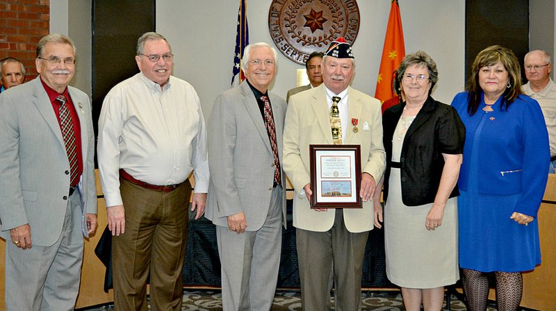 Photo submitted U.S. Army Veteran Frank Lee of Siloam Springs was honored with the Medal of Patriotism by the Cherokee Nation during their March Tribal Council Meeting. Lee is the commander of Siloam Springs VFW Post 1674 as well as the larger VFW District 1. Pictured, from left, are Cherokee Nation Deputy Chief S. Joe Crittenden, Tribal Councilor Jack Baker, Principal Chief Bill John Baker, U.S. Army Veteran Frank Lee and his wife Belva Lee, and Tribal Councilor Wanda Hatfield.