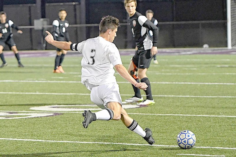 Bud Sullins/Special to Siloam Sunday Siloam Springs senior Austin Shull takes a free kick against Grove, Okla., on March 6 at Panther Stadium.