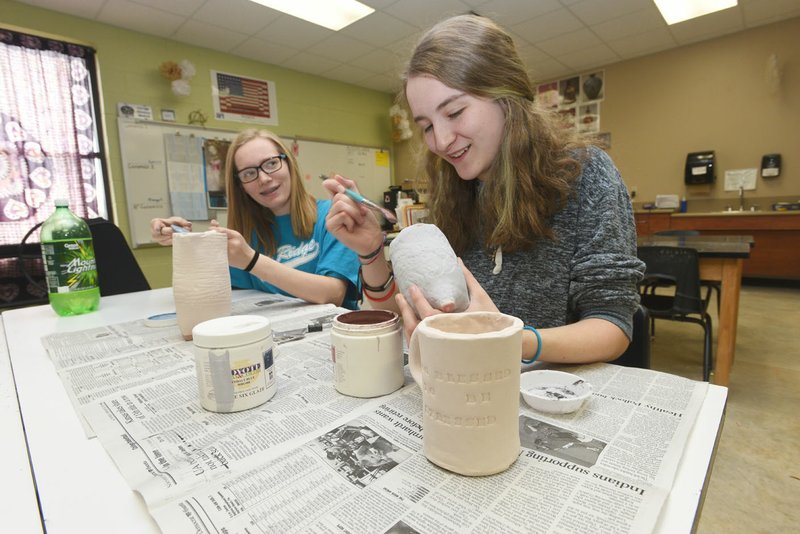 Hannah Howell (left) and Kameryn Thomason work on projects in a ceramics class March 15 at Pea Ridge High School. The district will ask voters in May to pay another 5.1 mills annually to build a new high school.