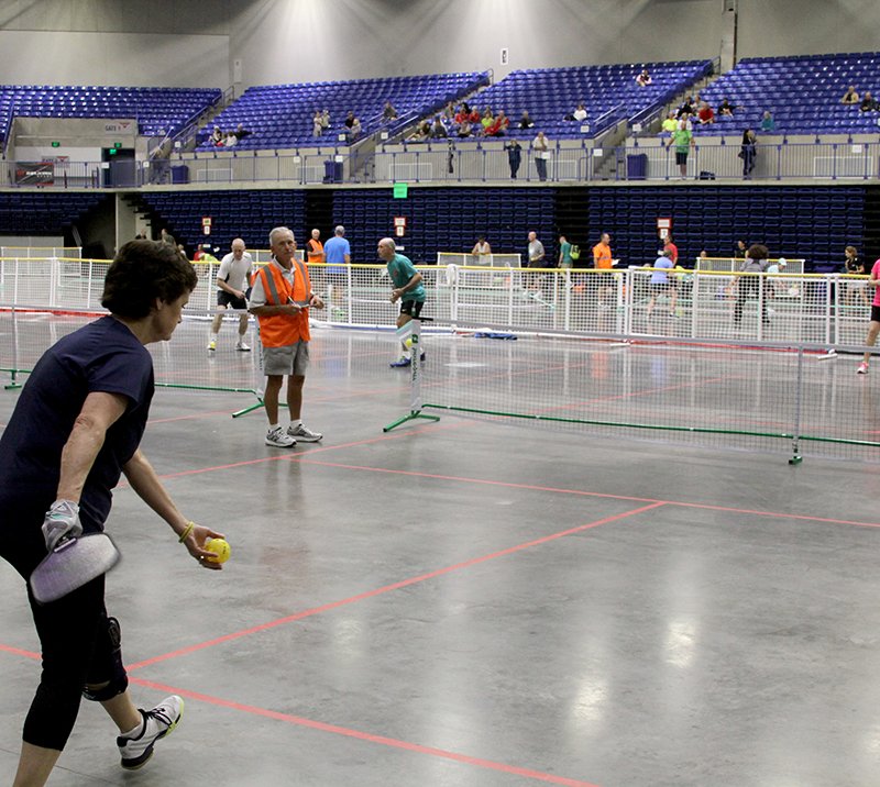 The Sentinel-Record/Max Bryan SERVICE: Debbie Easton, of Dallas, Texas, prepares to serve during a pickleball match Saturday at the Mid-America Indoor Pickleball Championships at Hot Springs Convention Center.