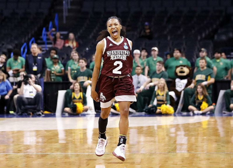 Junior guard Morgan William (right) celebrates after scoring a career-high 41 points Sunday to carry Mississippi State past Baylor 94-85 in overtime to win the Oklahoma City Regional of the NCAA women’s basketball tournament.