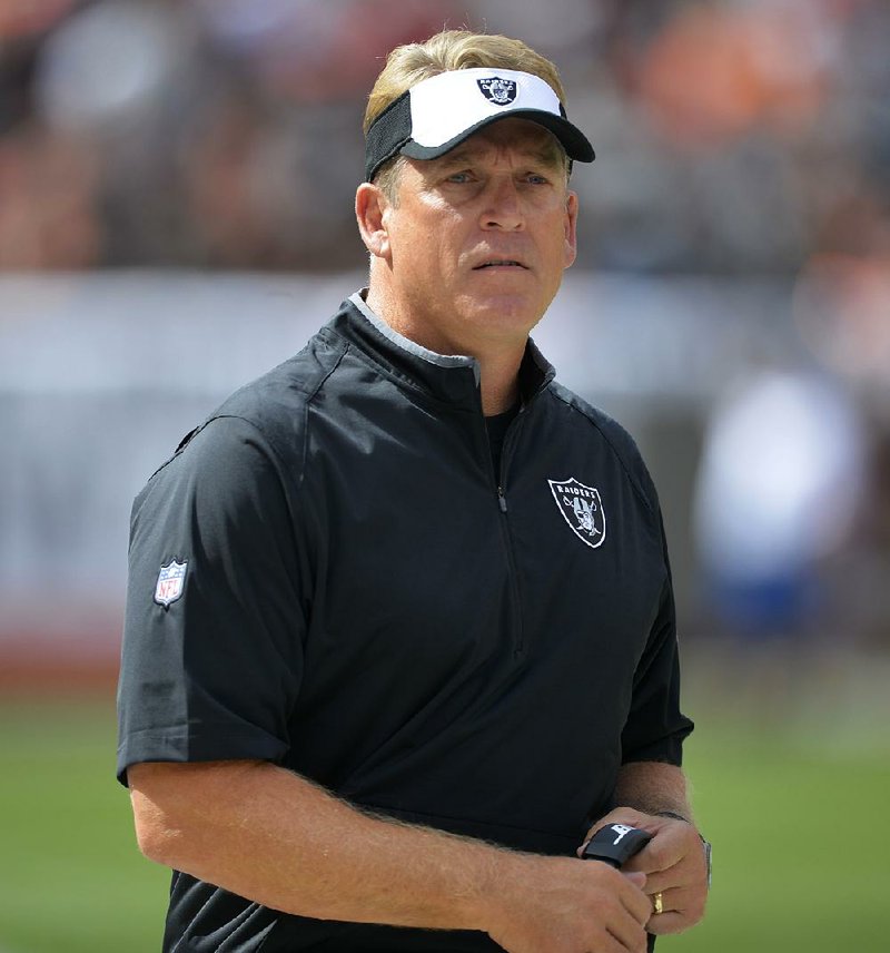 Oakland Raiders head coach Jack Del Rio watches before an NFL football game between the Raiders and the Cleveland Browns, Sunday, Sept. 27, 2015, in Cleveland. 
