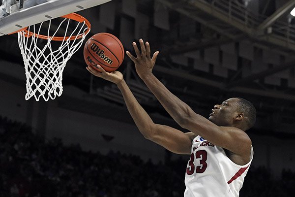 Arkansas's Moses Kingsley (33) drives to the basket against Seton Hall during the second half in a first-round game of the NCAA men's college basketball tournament in Greenville, S.C., Friday, March 17, 2017. (AP Photo/Rainier Ehrhardt)

