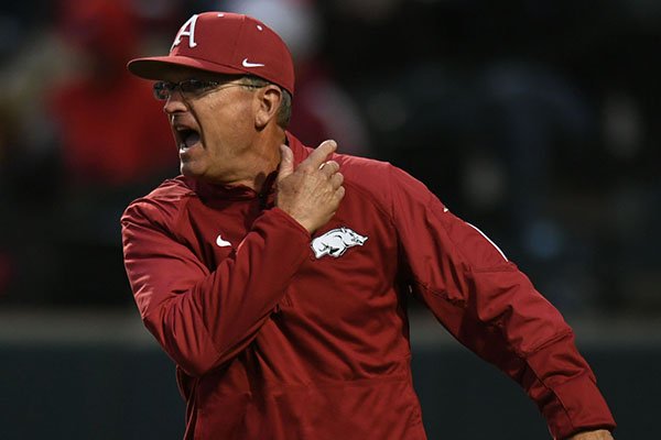 Arkansas coach Dave Van Horn argues with the plate umpire after Grant Koch was initially called out after hitting a ball off the screen that was caught by New Orleans catcher John Cable Wednesday, March 22, 2017, during the fifth inning at Baum Stadium.