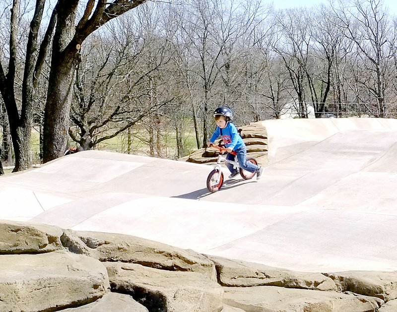 Lynn Atkins/The Weekly Vista Three-year-old Owen Kelly had the pump track to himself for part of the afternoon last Thursday. He was riding a balance bike with no pedals, while his father supervised. The new bike skills park is located inside Metfield Park on Bella Vista&#8217;s east side.