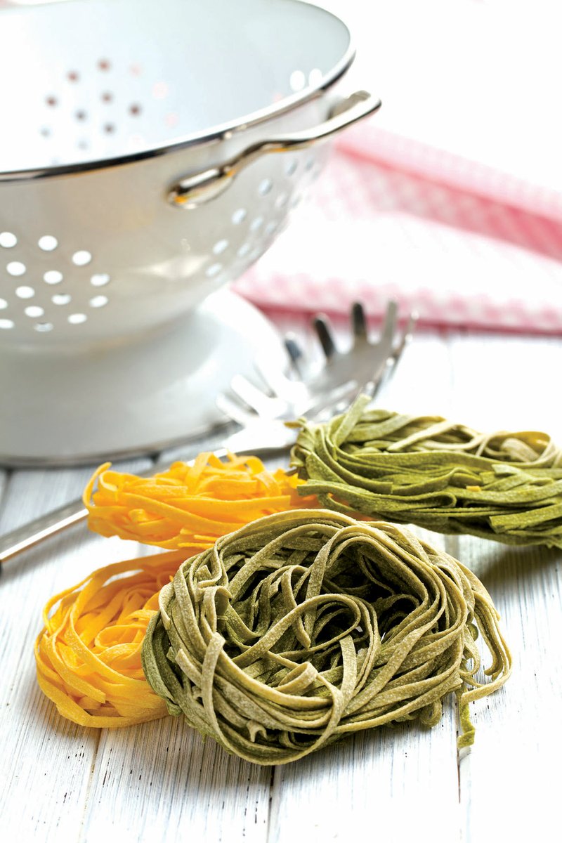 Two kinds of fresh fettuccine are used to make this pasta dish.