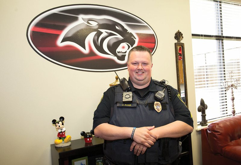 Sgt. John Dodd, school resource officer for the Cabot Public Schools, stands in the office of Freshman Academy principal Tanya Spillane. Dodd, who has been a police officer for 10 years, initiated the new Junior Police Academy program, which will take place June 12-16 and July 10-14, as well as the Special Needs Junior Police Academy Day Camp, which will take place June 24.