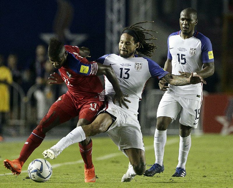 Panama’s Armando Cooper (left) fights for the ball with the United States’ Jermaine Jones during Tuesday night’s 2018 World Cup qualifying soccer match in Panama City. The U.S. moved into a tie for fourth place with Honduras in the North and Central America and Caribbean standings by earning a 1-1 draw with the Panamanians. 