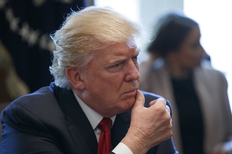 President Donald Trump listens during an opioid and drug abuse listening session, Wednesday, March 29, 2017, in the Cabinet Room of the White House in Washington. (AP Photo/Evan Vucci)