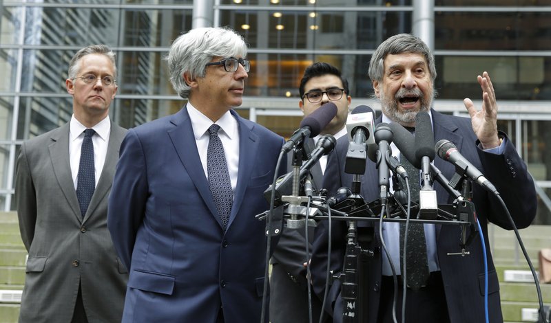 In this March 8, 2017, file photo, Mark Rosenbaum, right, an attorney for Daniel Ramirez Medina, talks to reporters outside the federal courthouse in Seattle, as fellow attorneys, from left, Ethan Dettmer, Theodore Boutrous Jr., and Luis Cortes, look on.  (AP Photo/Ted S. Warren, File)