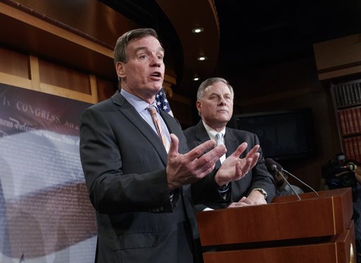 Senate Intelligence Committee Vice Chairman Sen. Mark Warner, D-Va., left, with Committee Chairman Sen. Richard Burr, R-N.C., speaks during a news conference on Capitol Hill in Washington, on Wednesday, March 29, 2017, to discuss their panel's investigation of Russian interference in the 2016 election. 