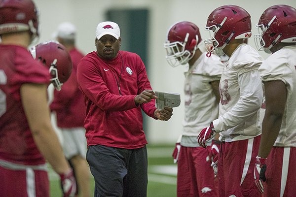 Arkansas defensive line coach John Scott talks to his group during practice Thursday, March 30, 2017, in Fayetteville. 