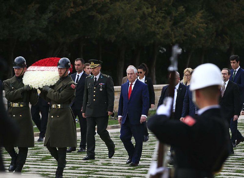 U.S. Secretary of State Rex Tillerson (center) prepares to lay a wreath at the mausoleum of Turkey’s founder, Mustafa Kemal Ataturk, in Ankara on Thursday.