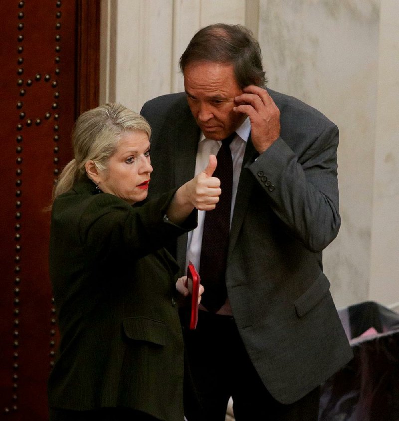 Sen. Linda Collins-Smith signals her yes vote Friday for House Bill 1866, which Sen. Gary Stubblefield (right) spoke in favor of on the Senate floor.