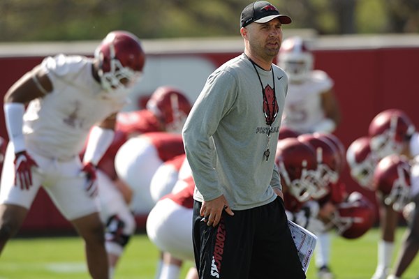 Arkansas assistant coach Barry Lunney Jr. directs his players Thursday, March 31, 2016, during practice at the university's practice field on campus in Fayetteville.