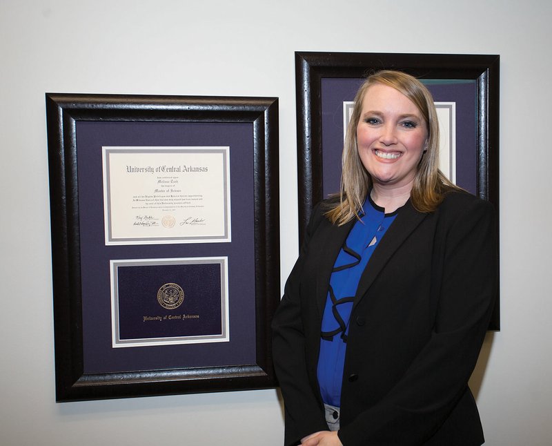 New Bald Knob School District Superintendent Melissa Gipson stands next to the master’s-degree diploma she received from the University of Central Arkansas in Conway. Gipson was promoted to superintendent after serving three months in the interim following the death of Superintendent Bradley Roberts on Nov. 13