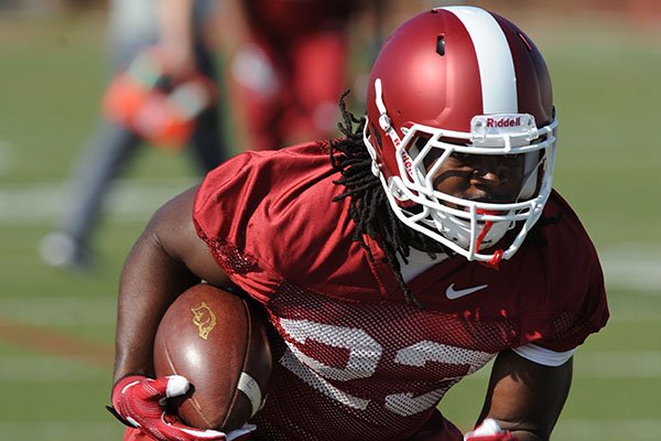 Arkansas running back Maleek Williams goes through practice Tuesday, March 28, 2017, in Fayetteville. 