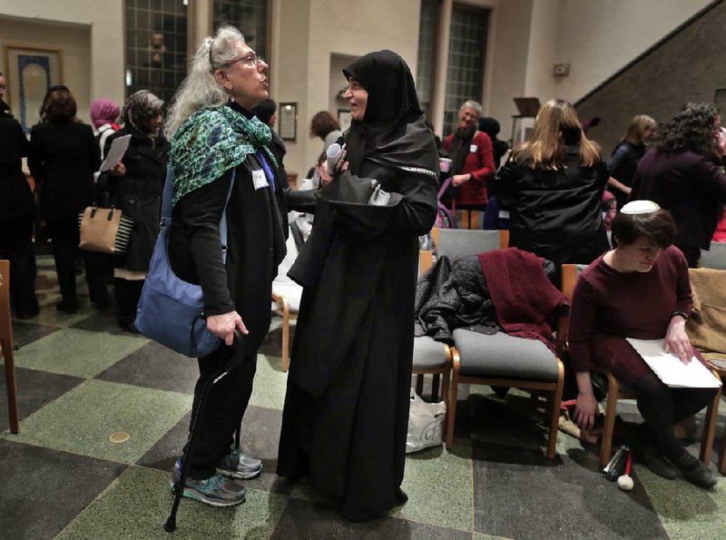 Members of the Sisterhood Salaam Shalom talk after a unity vigil held at the Jewish Theological Seminary in
New York. The Sisterhood of Salaam Shalom is a national organization that brings together Muslim and Jewish
women.