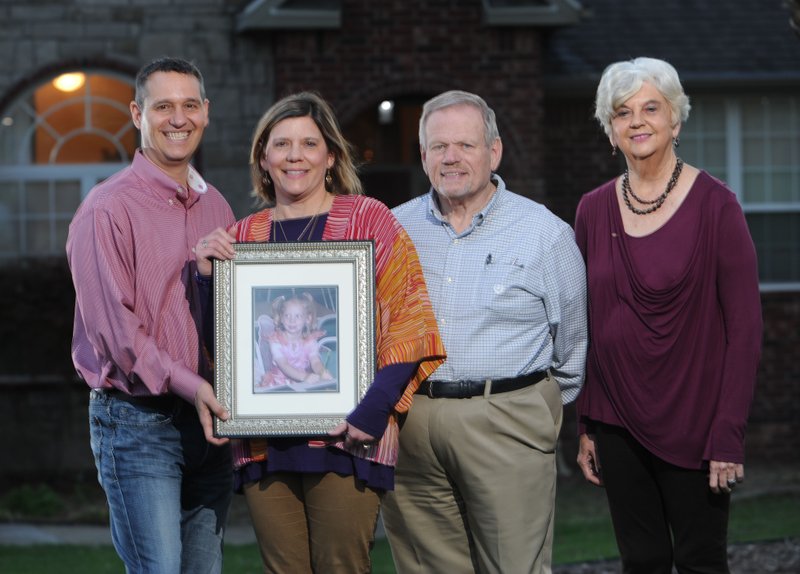 Derrick Bobbitt (from left) and his wife, Susan Averitt, along with Susan’s parents Biff and Ann Averitt, all of Fayetteville, hold a picture of their daughter Cameron Averitt Bobbitt. Cameron was killed at age 5 in a school crosswalk in Oklahoma. Susan, with help from her parents, has organized a conference for other parents who have lost children, designed to give them tools to move forward despite their grief. Susan and her parents also work with the grieving parents support group which meets the second Monday of each month at Rolling Hills Baptist Church in Fayetteville.