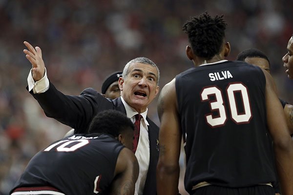 South Carolina head coach Frank Martin talks to his players during the second half in the semifinals of the Final Four NCAA college basketball tournament against Gonzaga, Saturday, April 1, 2017, in Glendale, Ariz. (AP Photo/David J. Phillip)

