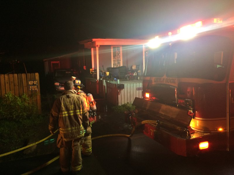 Crews work the scene of a fire in Little Rock Sunday night.