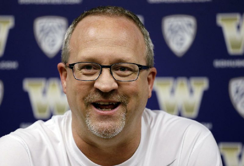 Washington head coach Mike Neighbors speaks during a news conference Tuesday, March 29, 2016, in Seattle. Washington plays Syracuse in a Final Four basketball game Sunday. 
