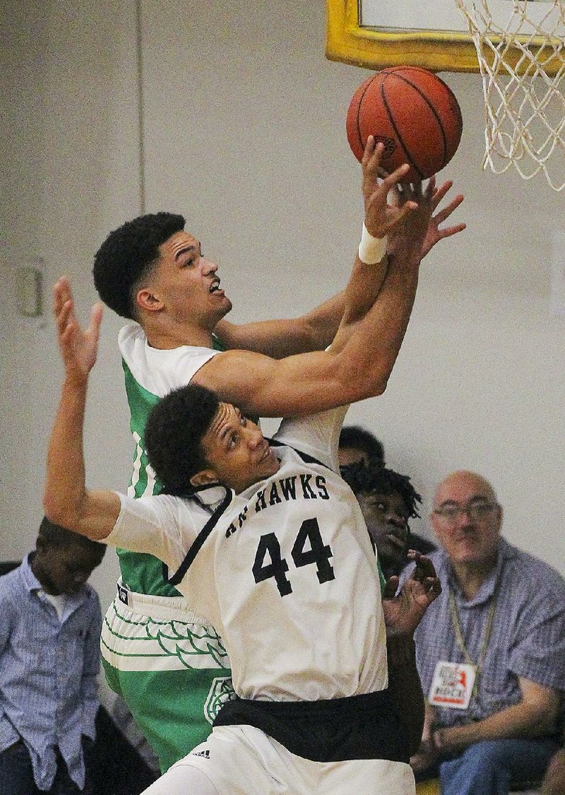 Arkansas Hawks’ Ethan Henderson (44) blocks a shot by Zac Watson late in the second half of Marcus Smart’s 73-72 victory in the 17-Under championship game at P.A.R.K. in Little Rock.