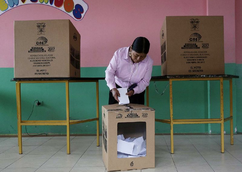 A woman casts her ballot during a presidential runoff election Sunday in Quito, Ecuador.
