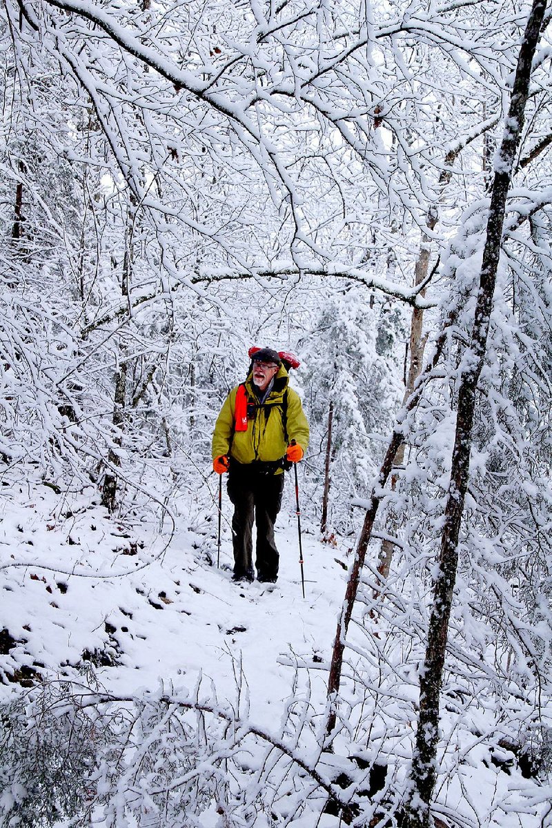 Chuck Gibson of Dermott hikes part of the Buffalo River Trail’s new extension March 12 between South Maumee Road and Grinder’s Ferry, admiring snow-covered rocks and trees.