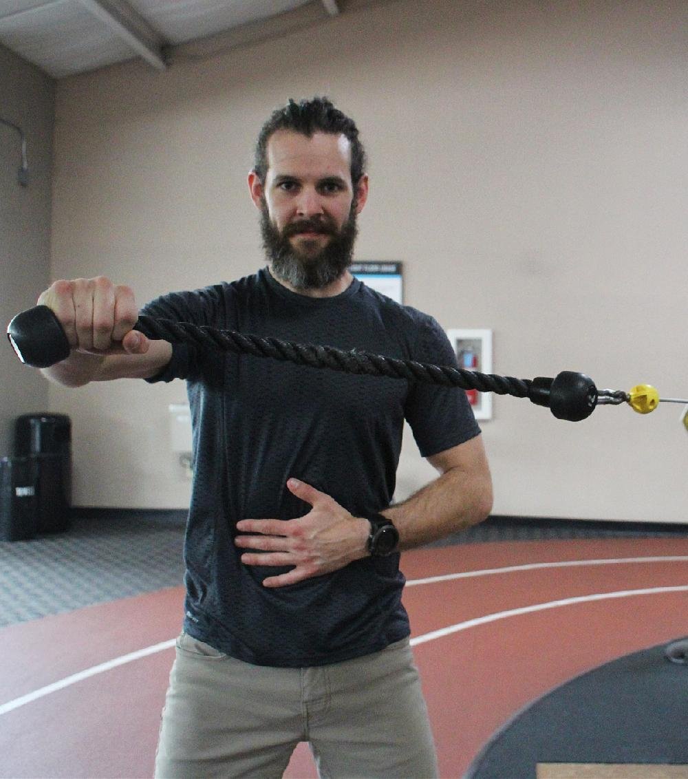 Lateral Rope Extension targets triceps muscles